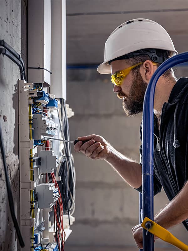 electrician working on an electrical panel